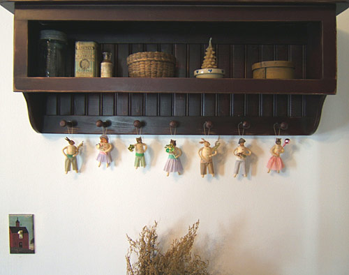 spun cotton ornaments on a peg rack