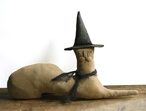 primitive cat doll in a witch hat